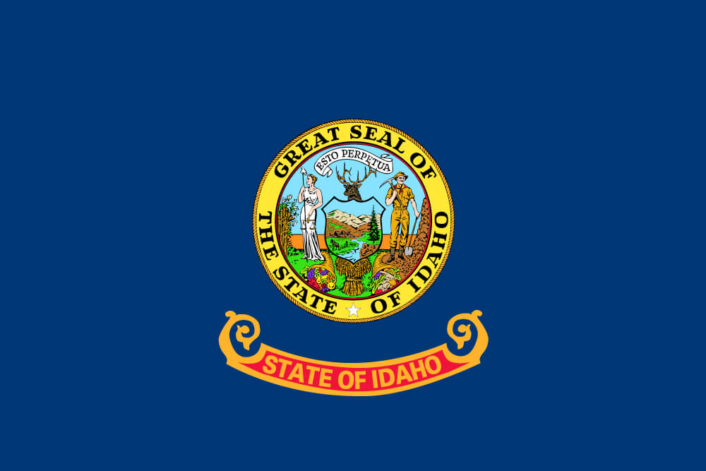 a field of blue charged with the state seal featuring the goddess Justice and a miner; “Idaho” is inscribed on a banner below